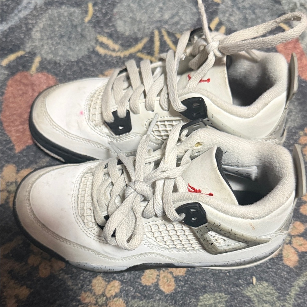 Jordan 4’s White cement and Black Sneakers